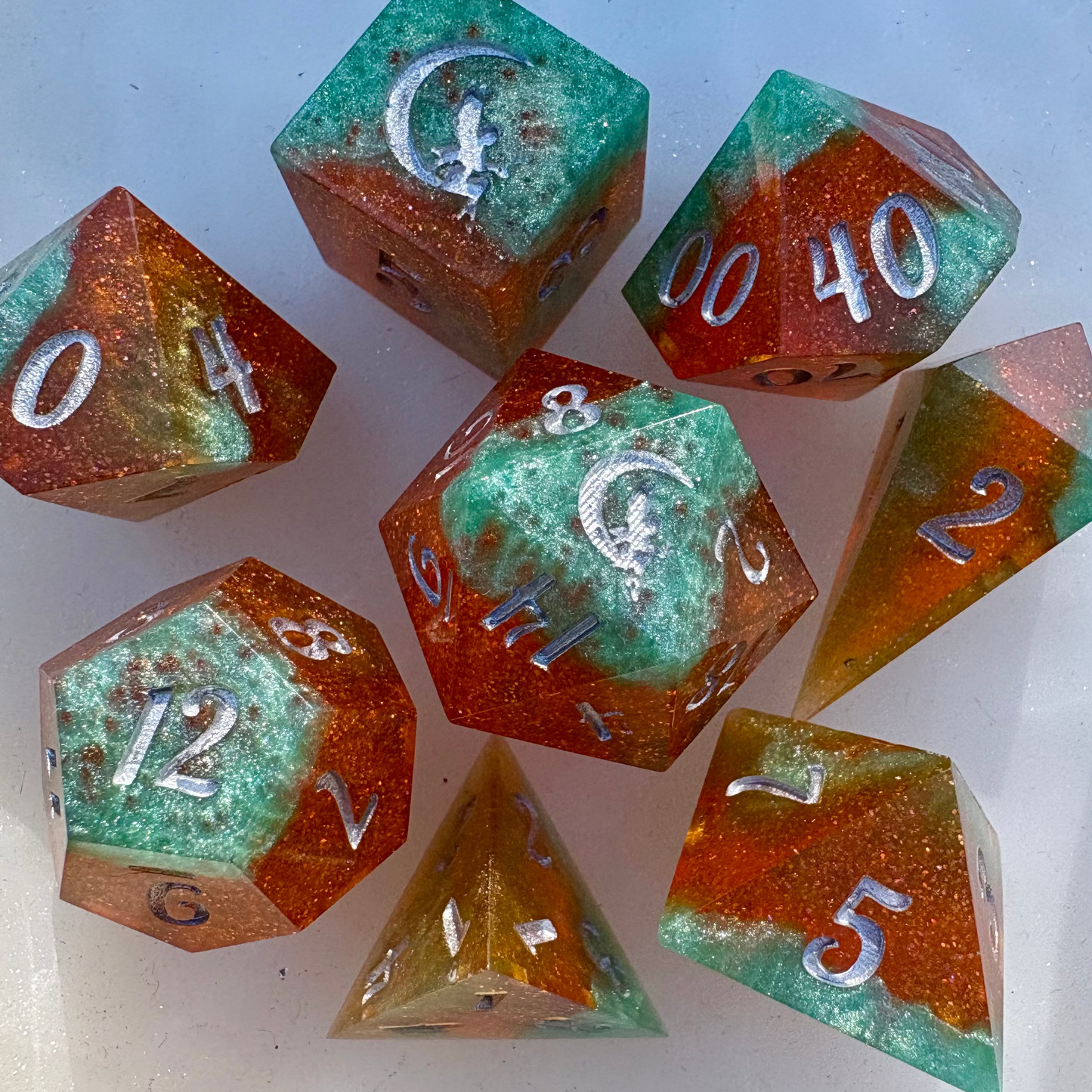 TLOAS inspired dice set with glittery orange and vibrant pale green