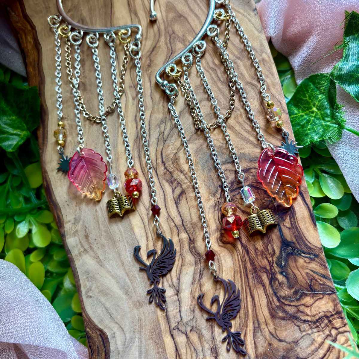 elven ear cuffs featuring iridescent beads, leaves, and phoenix charms